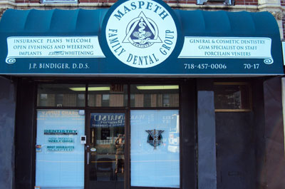 The image shows a storefront with a sign that reads  MASPETH FAMILY DENTAL CLINIC  and includes contact information, indicating that this is a dental clinic located at 637 Maple Street in Maspeth, New York.